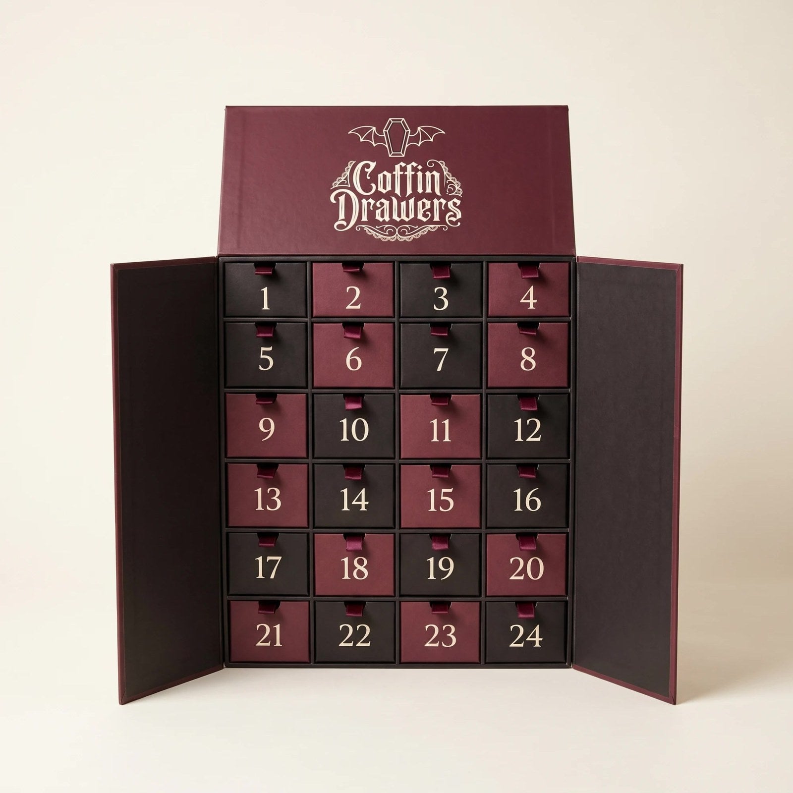 The Coffin Drawers calendar open, 24 numbered drawers in burgundy and black